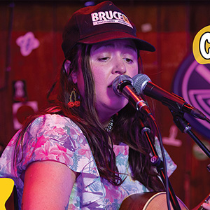Carrie Fussell sings into a mic